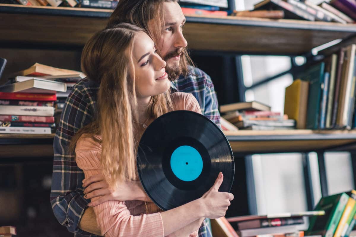Soundsifter. Music loving couple hold a record.